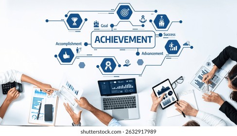 A dynamic group of professionals engage in a collaborative meeting focused on achievement, utilizing technology and data analysis to track goals and success strategies. Amity