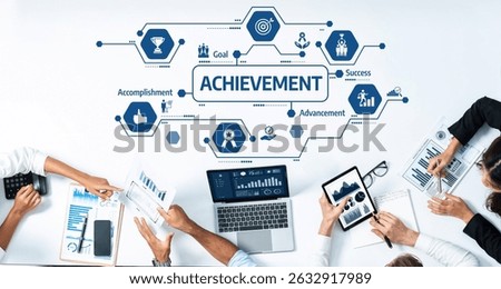 A dynamic group of professionals engage in a collaborative meeting focused on achievement, utilizing technology and data analysis to track goals and success strategies. Amity