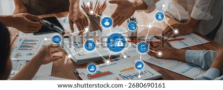 A dynamic group of professionals engages in a collaborative tax planning session, surrounded by financial charts and documents on a wooden desk. Amity