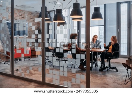 Similar – Group of young adults having business meeting in start up office