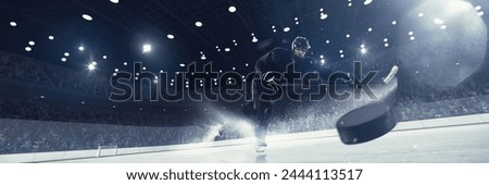 Dynamic image of competitive man, professional hockey player in uniform in motion during tournament, with puck on 3d render ice rink. Concept of sport, competition, match, game, action, tournament