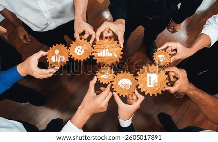 A dynamic image of diverse hands working together to hold gears, representing teamwork, strategy, and innovation in management for successful business outcomes. Amity