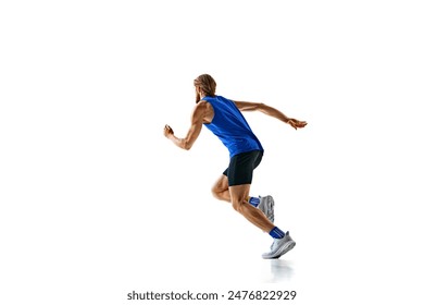 Dynamic image of man in a run, runner in motion, training isolated on white studio background. Speed and endurance. Concept of sport, marathon, competition, healthy and active lifestyle
