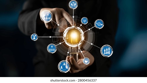 A dynamic image showcasing hands holding a glowing light bulb surrounded by technology icons, representing concepts of innovation, creativity, and business solutions in a digital context. Crux