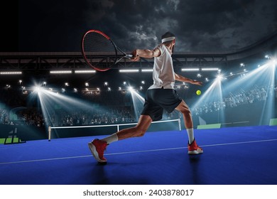 Dynamic image of young man, tennis player in motion during game, hitting ball with racket. 3D arena. Tennis court and fan zone. Concept of sport, competition, tournament, action, success