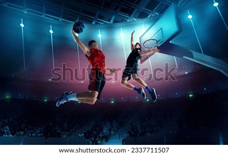 Dynamic image of young men, professional basketball players in motion, in a jump with ball under basket on 3D arena. Top view. Concept of professional sport, competition, action, hobby, game.