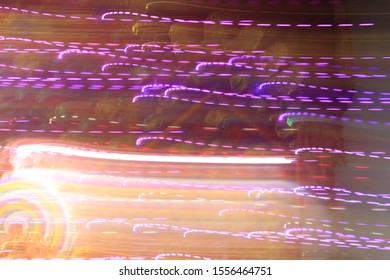 Dynamic lights in dark background. High speed in night time abstraction. Colorful LED light trails background. Motion blur effect.