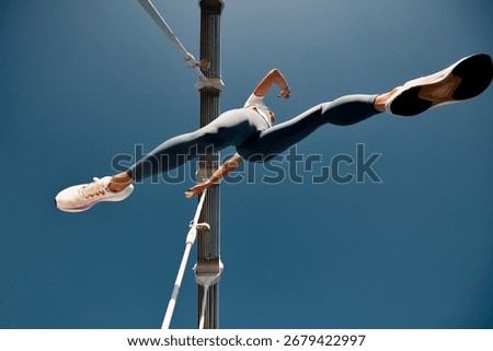Dynamic low-angle shot of an athletic individual in focused running motion