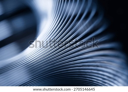 Dynamic macro pattern of bending linear structures forming spatial distortion, fluid curvature and futuristic depth. Photo