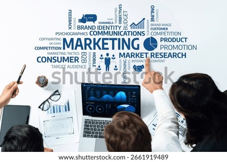 A dynamic marketing strategy session featuring data visualization and teamwork in an office setting, showcasing key marketing concepts and collaborative analysis for effective decision making. Amity