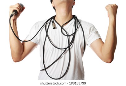 Dynamic Microphone In Asian Man Hand With Disorderly Cord On His Body, Isolated