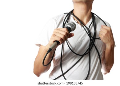 Dynamic Microphone In Asian Man Hand With Disorderly Cord On His Body, Isolated