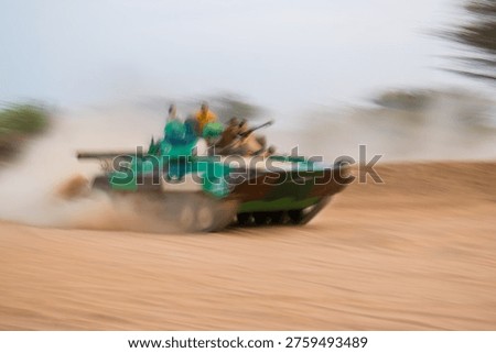 dynamic motion blur shot of a fast-moving BMP tank racing across a sandy desert landscape