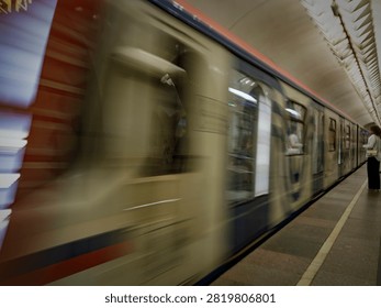 Dynamic motion blur of a subway train arriving at an underground station platform. Concept of fast urban transportation and city life.
