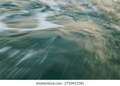 Dynamic motion of ocean waves with blurred water surface.