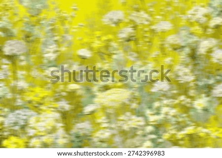 A dynamic, motion-blurred image capturing the essence of a field of yellow and white flowers in vibrant motion.