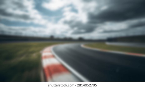 A dynamic, motion-blurred view of a racing circuits asphalt track with distinctive red and white curbs, set against a dramatic, overcast sky.