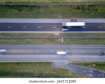 A dynamic overhead view captures a busy highway scene, showcasing the flow of traffic including trucks and cars