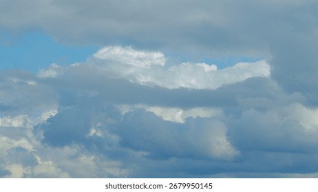 Dynamic patterns of clouds in a vast blue sky create an aweinspiring atmosphere