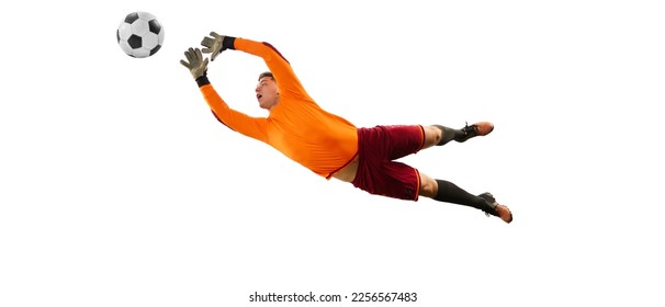 Dynamic portrait of professional soccer goalkeeper in sports uniform jumping and catching football ball isolated over white background. Concept of sport, action, motion, goals.