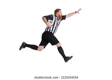 Dynamic portrait of soccer or football referee running with football ball isolated on white studio background. Concept of sport, rules, competitions, rights, ad, sales. Funny meme emotions