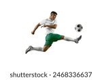 Dynamic portrait of young man, professional soccer player make perfect pass in mid-air against white studio background. Concept of professionals sport, competition, tournament, energy, action. Ad