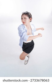 Dynamic Pursuit: Capturing the image of a focused female, mid-stride, showcasing determination. She's dressed casually and wears sunglasses, embodying a modern, active, and motivated spirit.