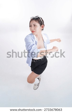Dynamic Pursuit: Capturing the image of a focused female, mid-stride, showcasing determination. She's dressed casually and wears sunglasses, embodying a modern, active, and motivated spirit.