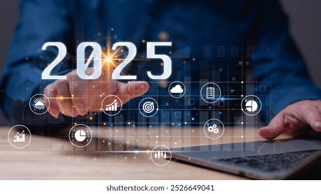 Dynamic representation of future, hand reaching out to engage with digital elements symbolizing data, technology, and strategic goals for year 2025
