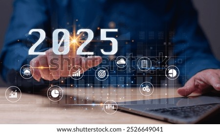 Dynamic representation of future, hand reaching out to engage with digital elements symbolizing data, technology, and strategic goals for year 2025