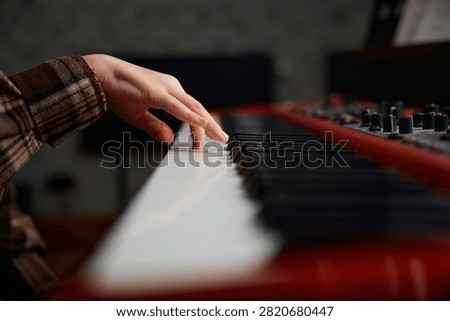 Dynamic scene capturing fingers practicing chords with artistic lighting and mood
