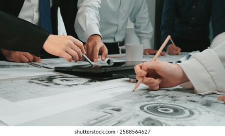 A dynamic scene capturing a group of professionals engaged in a collaborative planning session, surrounded by documents, technology, and creative discussions in a modern office. SACTR