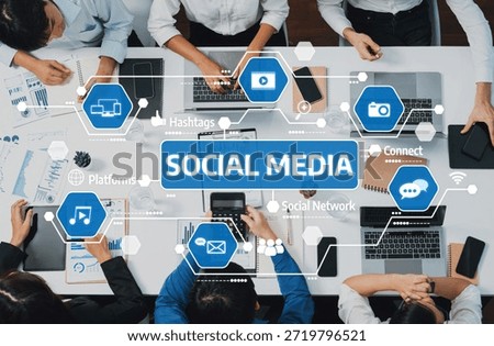 A dynamic scene of professionals collaborating on social media strategies, showcasing the importance of digital communication and teamwork in a modern workspace. Amity
