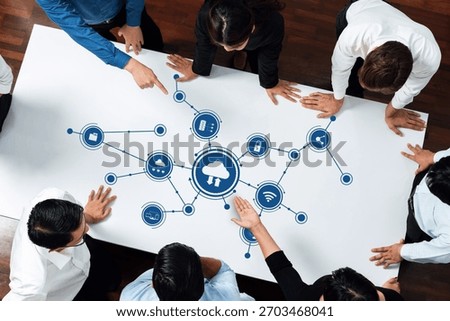 A dynamic scene of professionals working collaboratively on cloud computing ideas, using icons representing technology and connections, showcasing teamwork and innovation. Amity