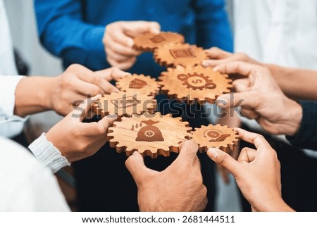 A dynamic scene showcasing hands working together with wooden gears, symbolizing collaboration in business processes that enhance efficiency and value creation. Amity