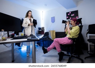 Dynamic scene showcasing two creative individuals in a modern workspace, engaged in photography and brainstorming. Presents a youthful and dynamic atmosphere of teamwork and design.