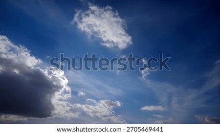 A dynamic sky filled with dramatic clouds, illuminated by bright sun rays creating a sense of awe and wonder.