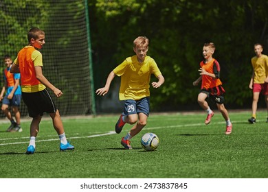 Dynamic Sports Training. Young soccer players practicing dribbling and passing skills during outdoor game. Coordination and sportsmanship. Concept of sport, school, childhood, hobby, active lifestyle - Powered by Shutterstock