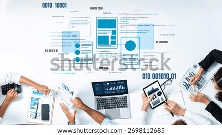 A dynamic team of professionals collaborates on data analysis, utilizing various digital devices in a modern office environment to enhance productivity and insight. Trope