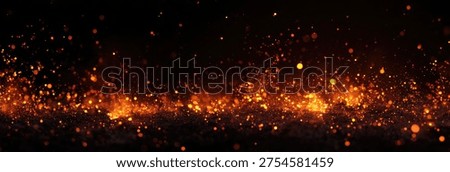 A dynamic and vibrant abstract background featuring a multitude of fiery orange and red sparks and glowing particles against a deep black backdrop, creating a sense of energy and movement.