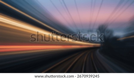 A dynamic view of train tracks and blurred lights, conveying a sense of speed and motion through a tunnel at twilight.
