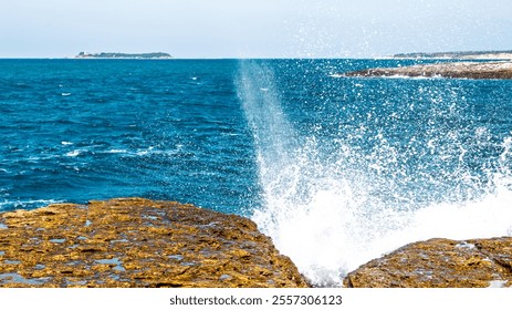 Dynamic waves strike the rugged cliffs, capturing the essence of nature's force and resilience. A powerful metaphor for strength, determination, and facing life's challenges.  - Powered by Shutterstock