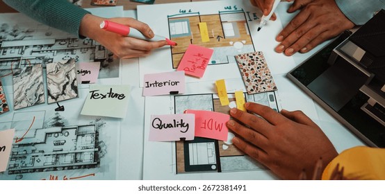 A dynamic workspace image showcasing hands engaged in a creative collaborative design process with colorful notes and architectural sketches for improved project outcomes. SACTR - Powered by Shutterstock - Get 15% off with code: PIKWIZARD15
