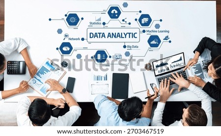 Dynamic workspace showcasing collaboration in data analytics with technology devices and visual data representation. Ideal for business and tech-related themes. Amity
