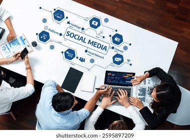 A dynamic workspace showcasing professionals collaborating on social media strategies and data analysis. The scene highlights technology role in digital communication and trends. Amity
