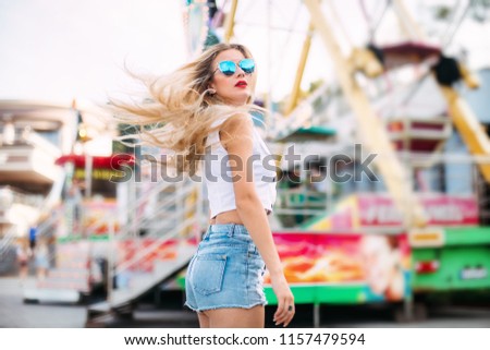 Similar – Image, Stock Photo Ferris wheel with fluttering barrier tape in front of it