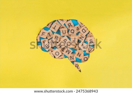 Dyslexia concept background, difficulty with fast reading, writing words, education learning elementary school kids, brain outline on color background with mixed letters and inscription dyslexia