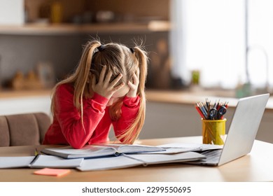 Dyslexia Concept. Little Girl Struggling With Homework, Stressed Preteen Female Child Having Reading Difficulties, Sitting At Desk At Home, Looking At Book And Touching Head With Despair, Copy Space