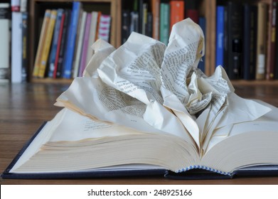 Dyslexia. An Opened Book With Crumpled Pages, To Indicate The Difficulty To Read.