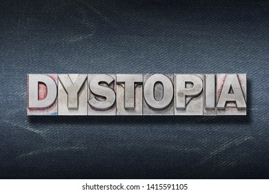 dystopia word made from metallic letterpress on dark jeans background